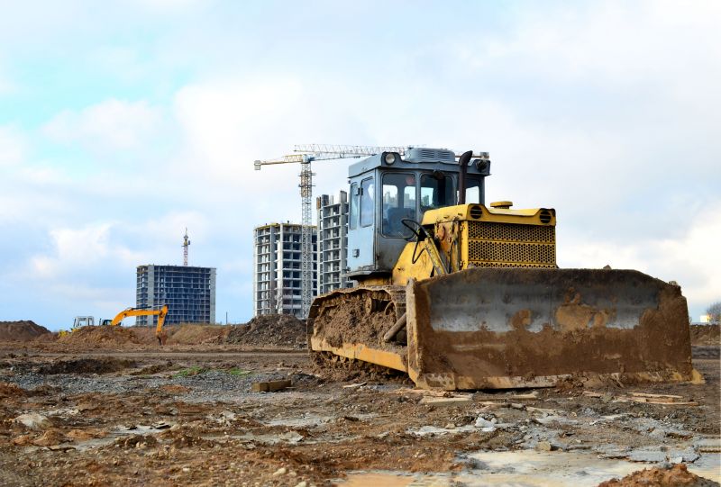 Prepares land for new commercial construction projects